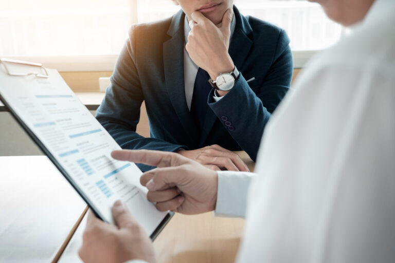 business man interviewer looking skeptical while listening to an